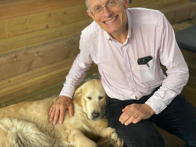 <p>Man's best friend: Simon Calder with golden retriever</p>