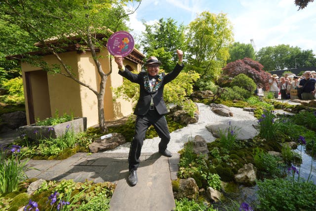 Kazuyuki Ishihara celebrated winning the RHS Chelsea garden of the year award (Yui Mok/PA)