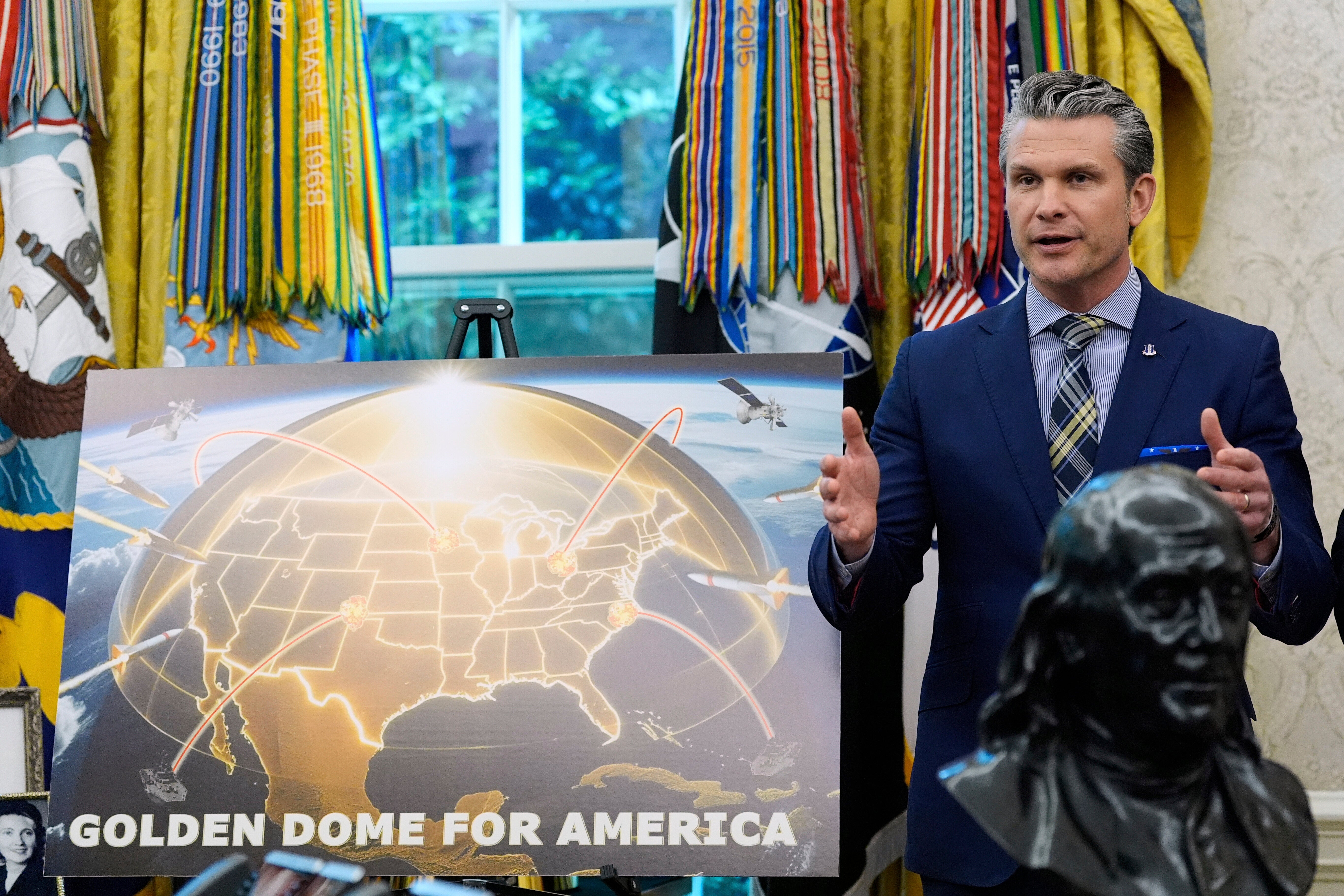Defense Secretary Pete Hegseth joins Trump in the Oval Office of the White House to unveil their Golden Dome defense project on May 20 2025