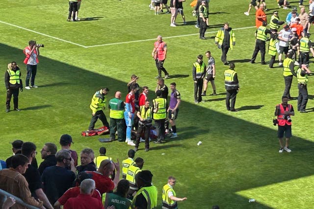 Aberdeen’s Jack MacKenzie was treated on the pitch (Ronnie Esplin/PA)