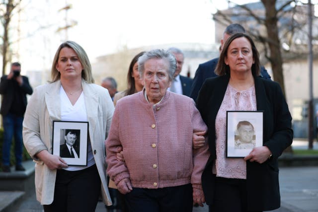 Bridie Brown, the wife of Sean Brown, with his daughters Siobhan Brown (right), Claire Loughran (left) outside the Royal Courts of Justice, Belfast (PA)