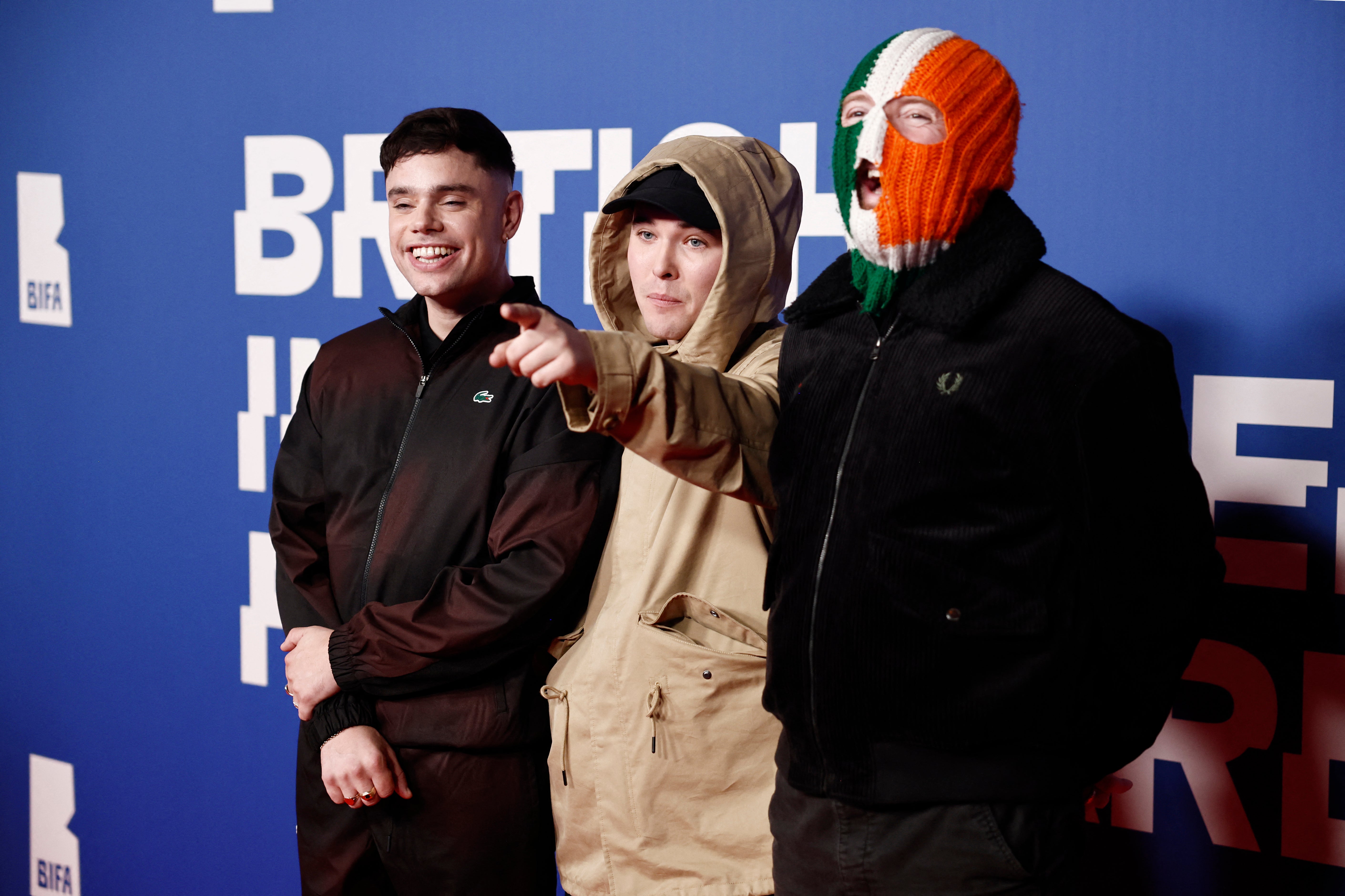 <p>Members of the Irish-language rap group Kneecap: Mo Chara (Liam Óg Ó hAnnaidh, centre), Moglai Bap (left) and DJ Provai</p>