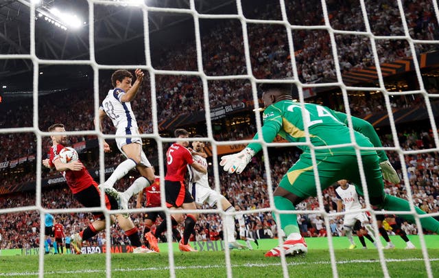 <p>Luke Shaw gets a touch as Tottenham take the lead in the final </p>
