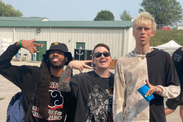 <p>Adam Ramey of the Dropout Kings (pictured centre, with his bandmate Eddie Wellz, left, and Machine Gun Kelly)</p>