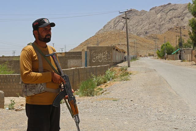 <p>A security personnel stands guard along a street near the site of a school bus bombing in the Khuzdar district of Balochistan province       </p>