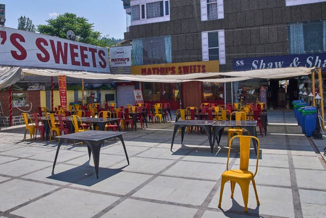 <p>Empty tables and chairs outside a restaurant near Dal Lake in Srinagar, Indian controlled Kashmir, India</p>