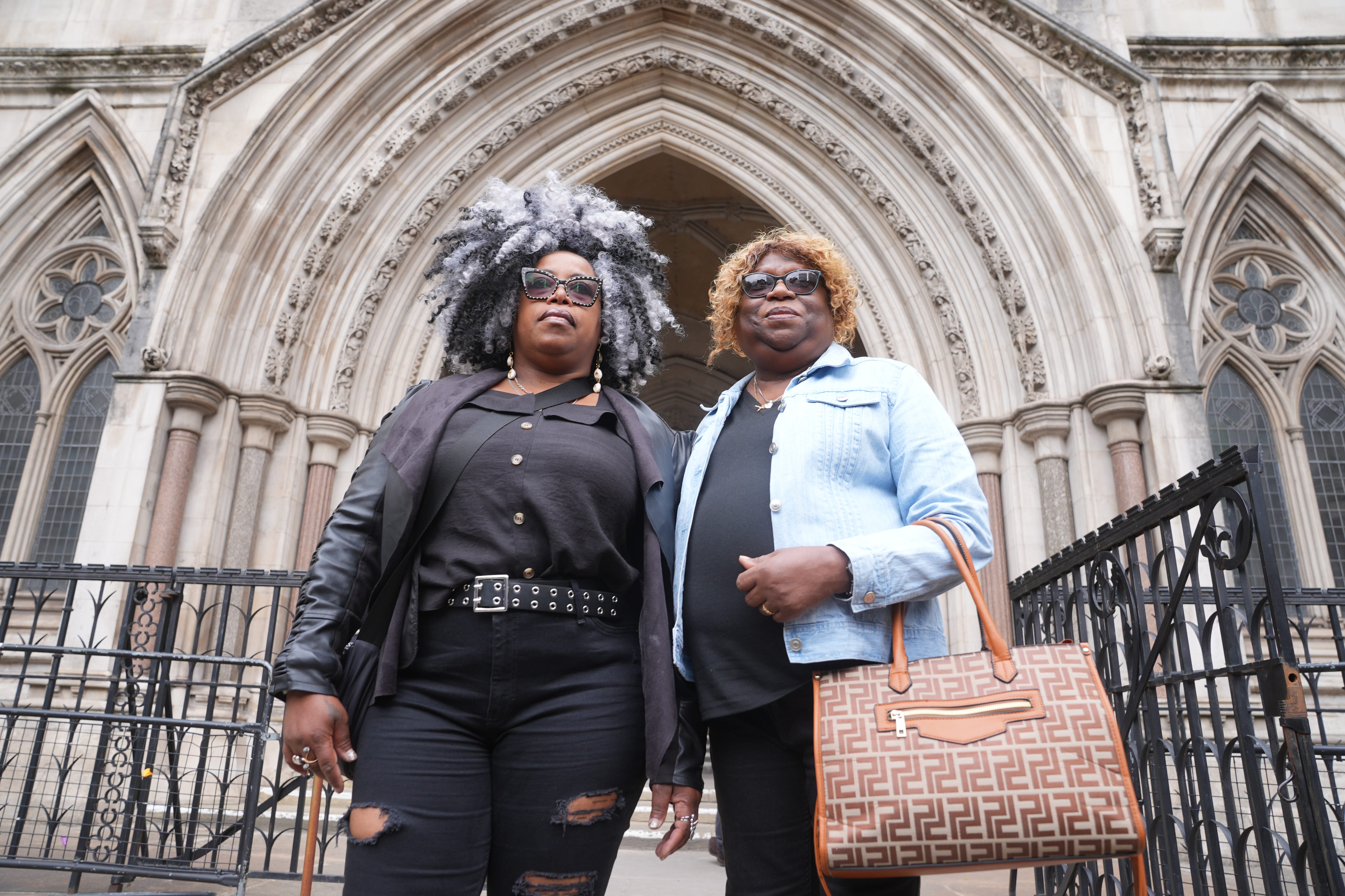 Bertice Pompe (left) and Bernadette Dugasse outside the High Court in central London (Yui Mok/PA)