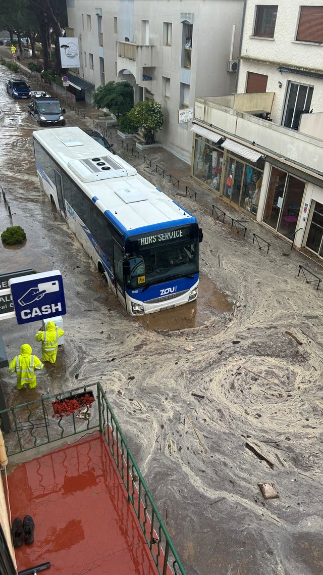 <p>A bus is partially submerged in floodwaters, following heavy rainfall, in Le Lavandou</p>