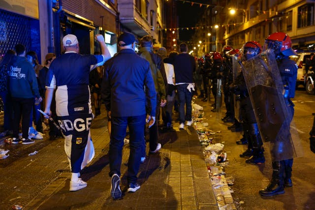 <p>Basque Police line up as supporters leave the stadium after the UEFA Europa League final football match between Tottenham Hotspur and Manchester United, in Bilbao, Spain on 21 May</p>