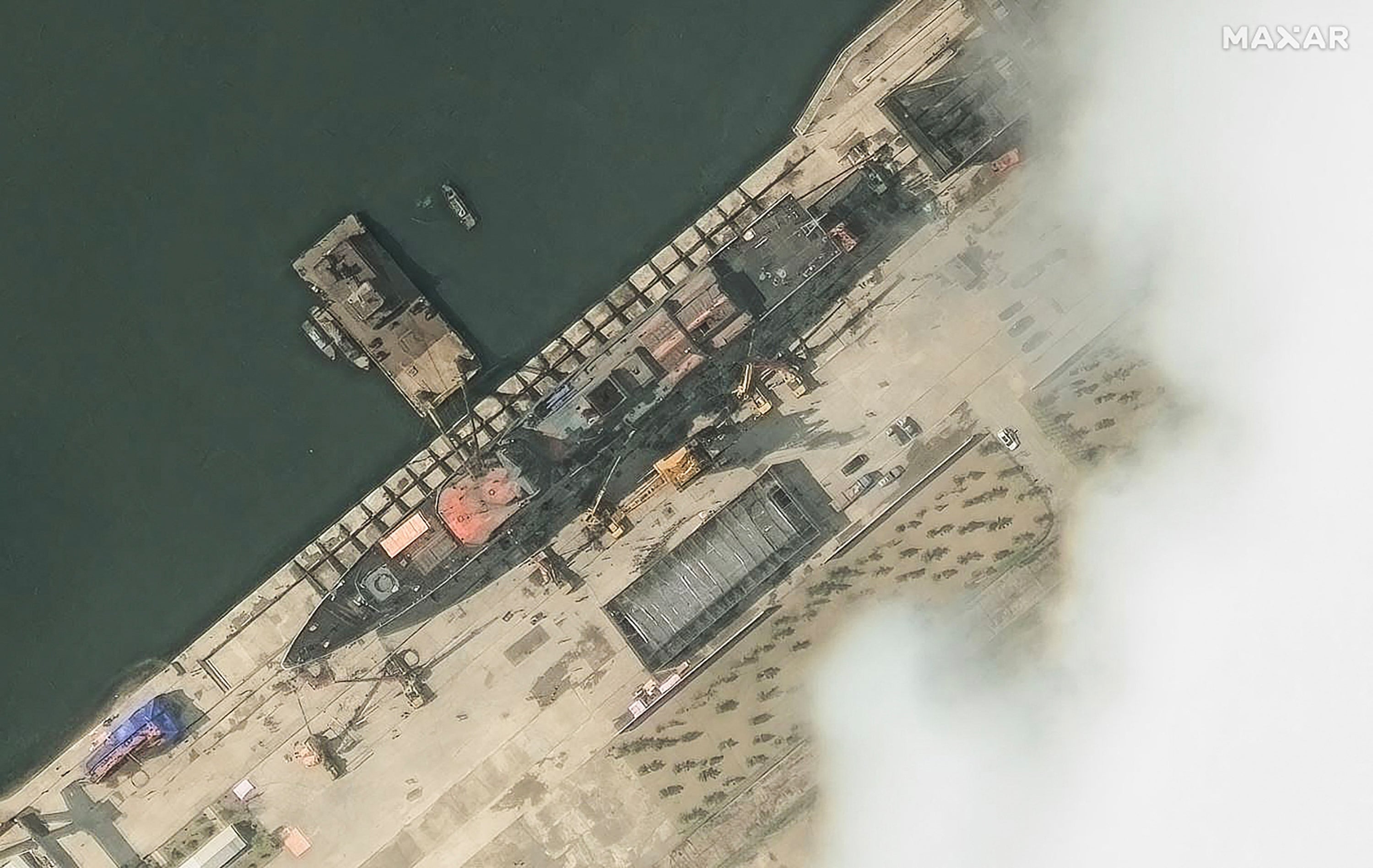 This handout satellite image courtesy of Maxar Technologies taken on 18 May 2025 and made available on 22 May 2025 shows a general view of a new North Korean warship at the harbour ahead of its launch in Chongjin