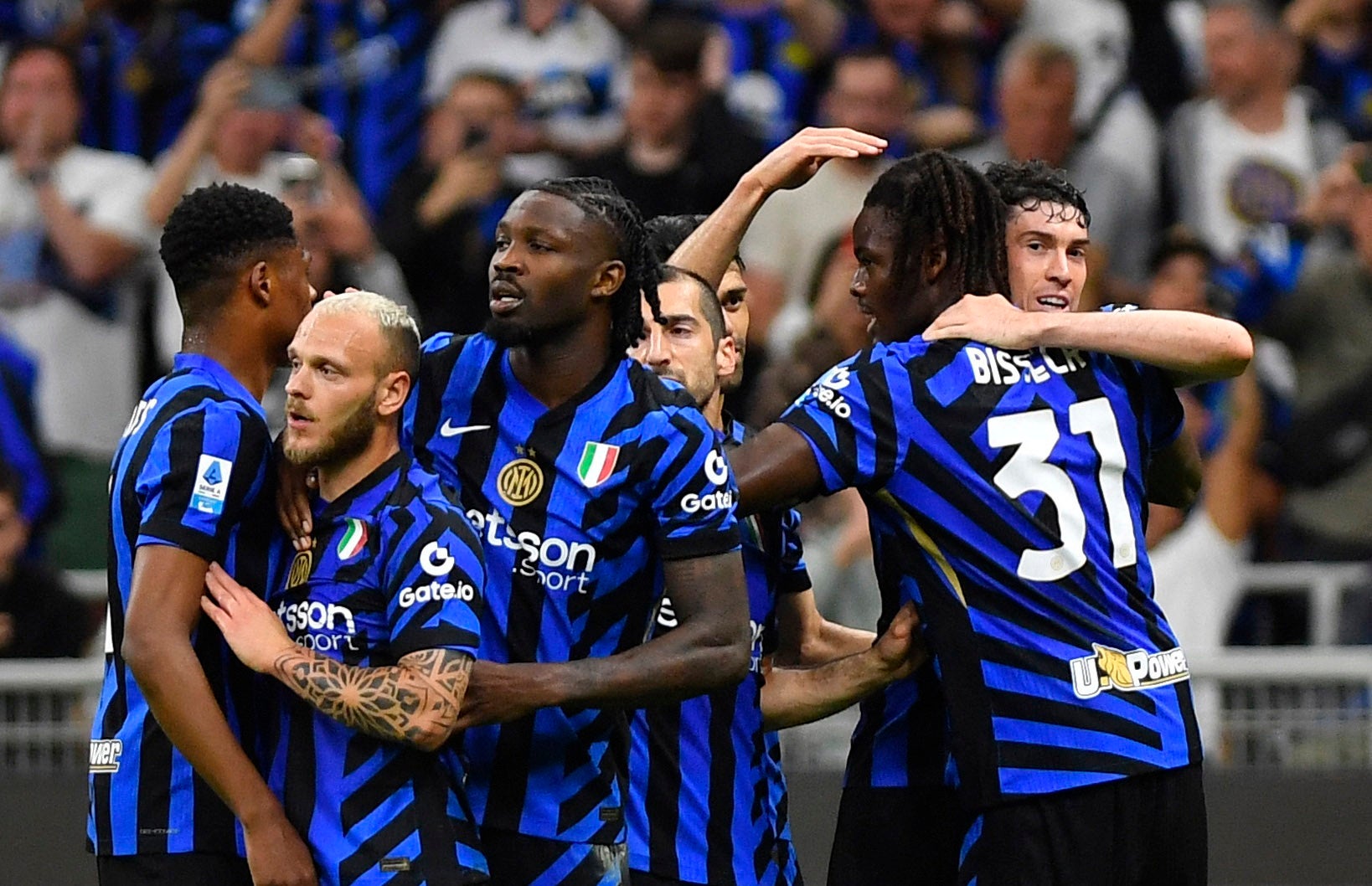 Inter Milan’s Yann Bisseck (right) celebrates after scoring against Lazio