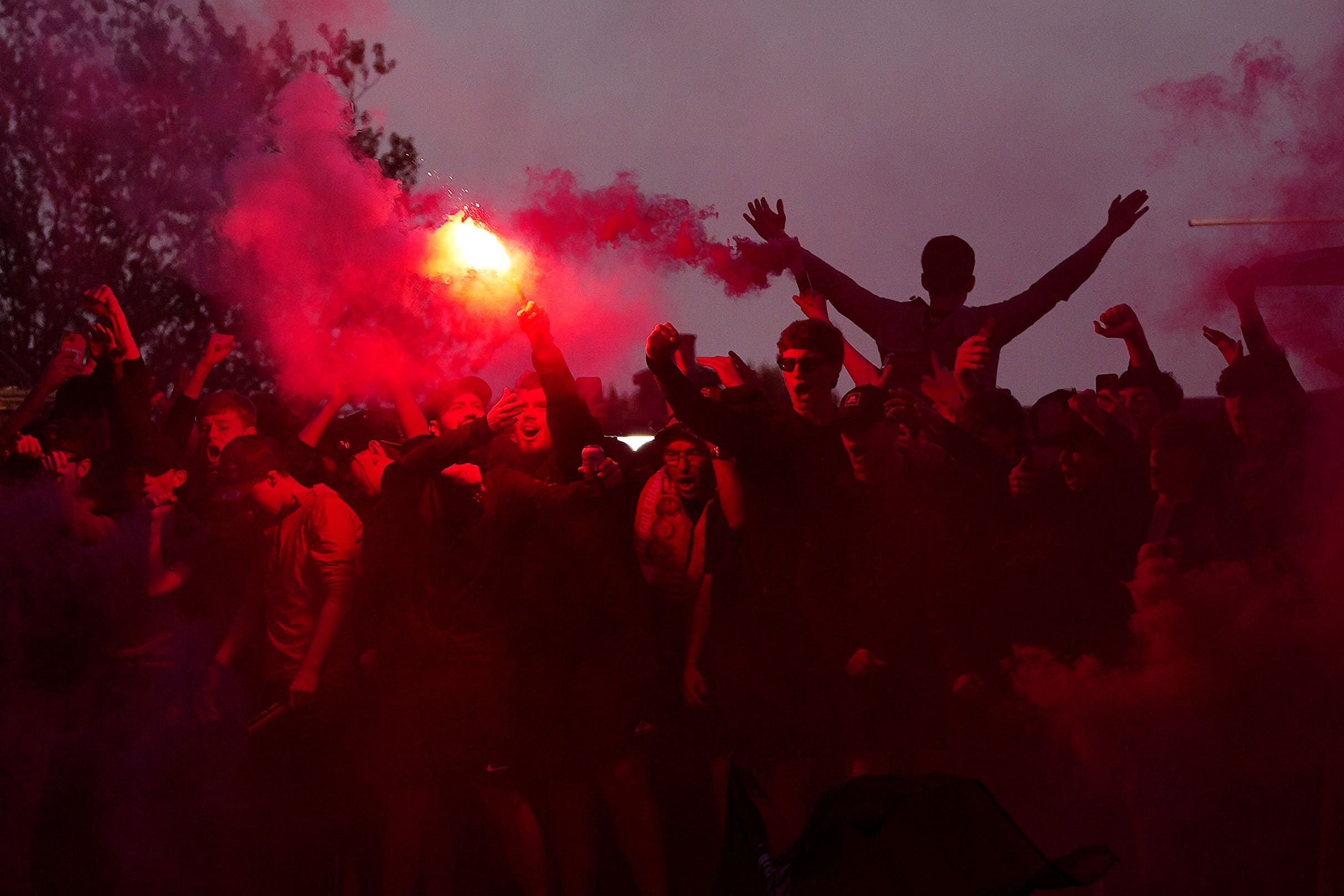 <p>Liverpool fans celebrate victory in the Premier League outside Anfield </p>