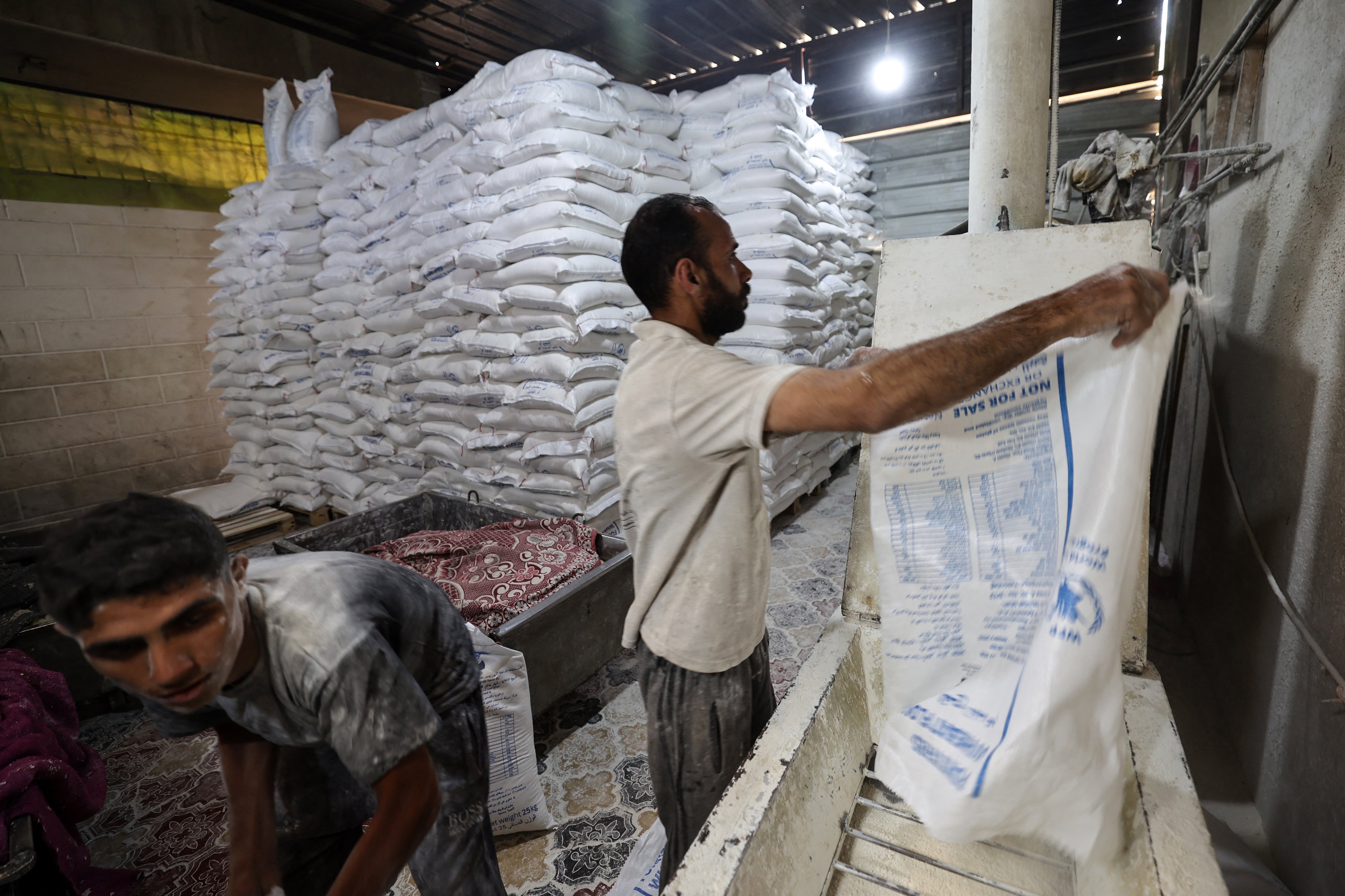Employees work inside a bakery in Deir el-Balah in the central Gaza Strip