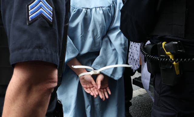 <p>A demonstrator is arrested as Columbia University and Barnard College students hold a graduation rally in support of Palestinians in New York on May 21</p>