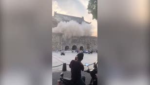 Tourists flee as 600-year-old tower roof collapses in China