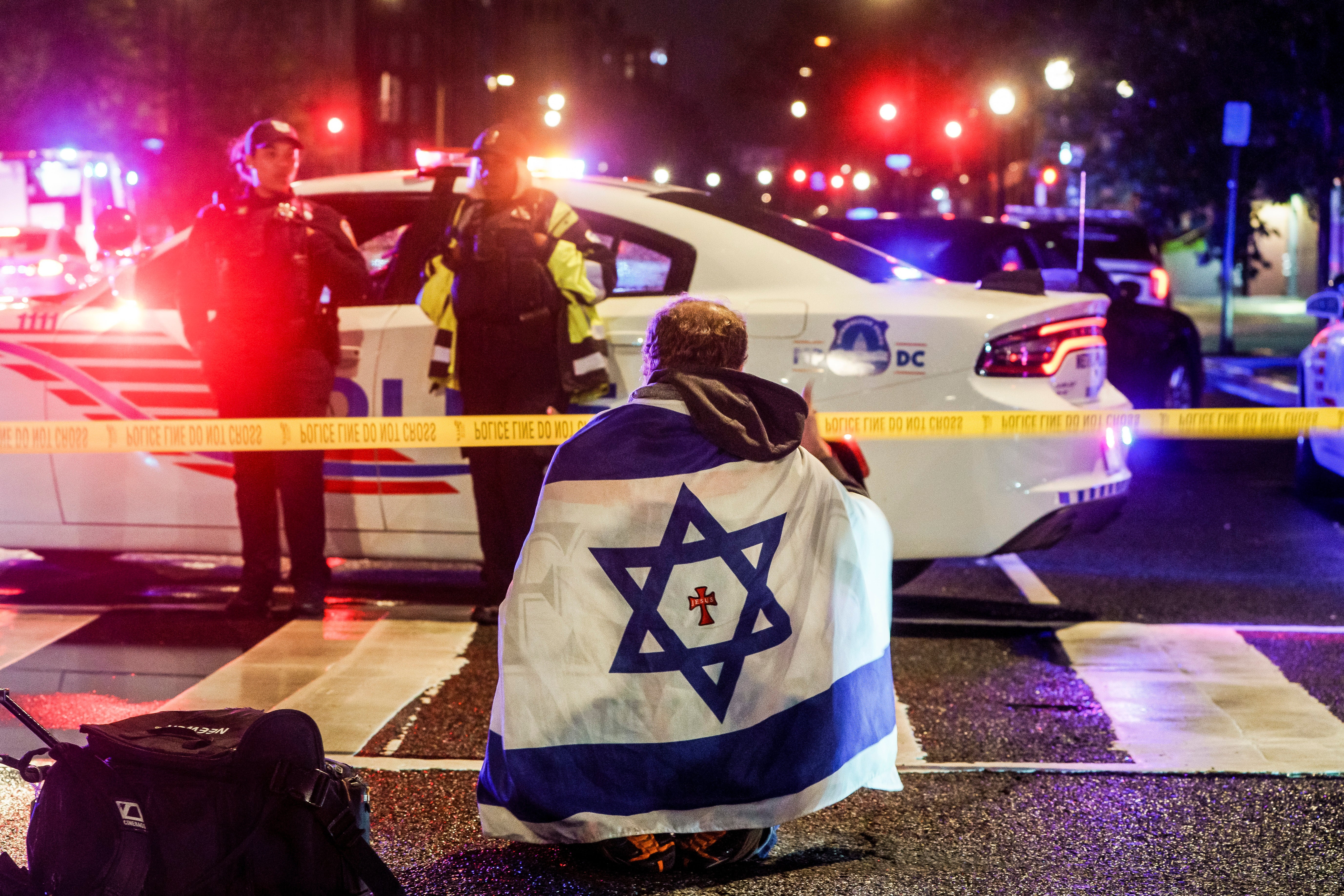 A man with an Israeli flag draped on his shoulders was spotted near the scene
