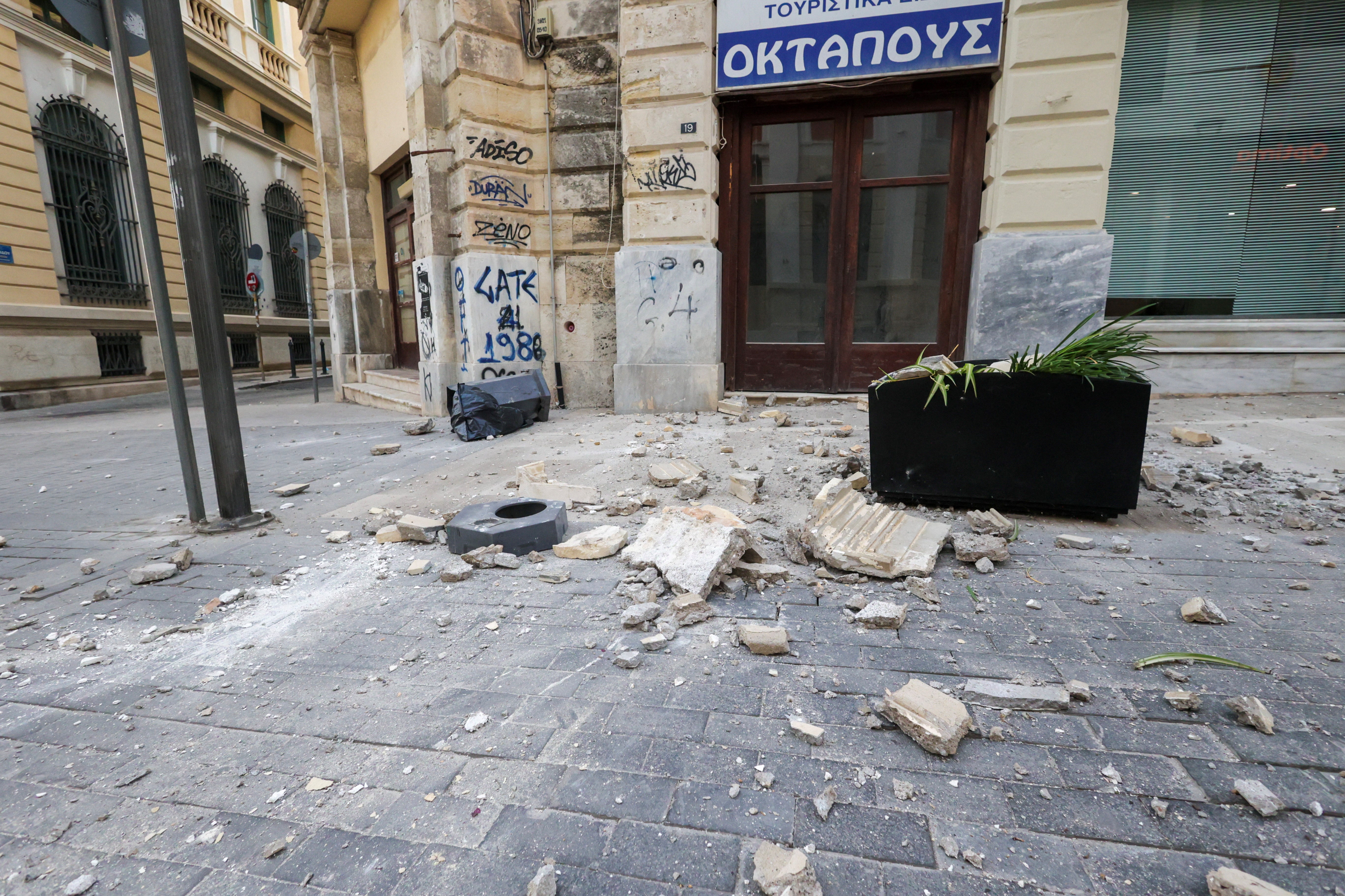 Debris is seen on the ground next to a building, following an earthquake that hit the island of Crete, in Heraklion, Greece on 22 May 2025