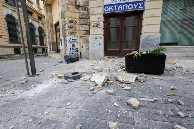 <p>Debris is seen on the ground next to a building, following an earthquake that hit the island of Crete, in Heraklion, Greece on 22 May</p>