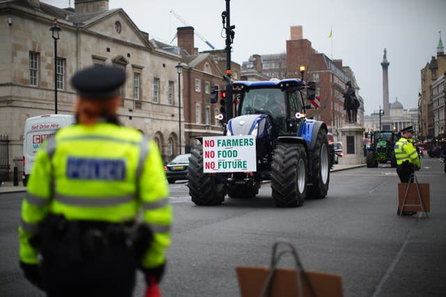 Farmers and their tractors during a protest in Westminster, London over the changes to inheritance tax (IHT) rules in February (James Manning/PA)