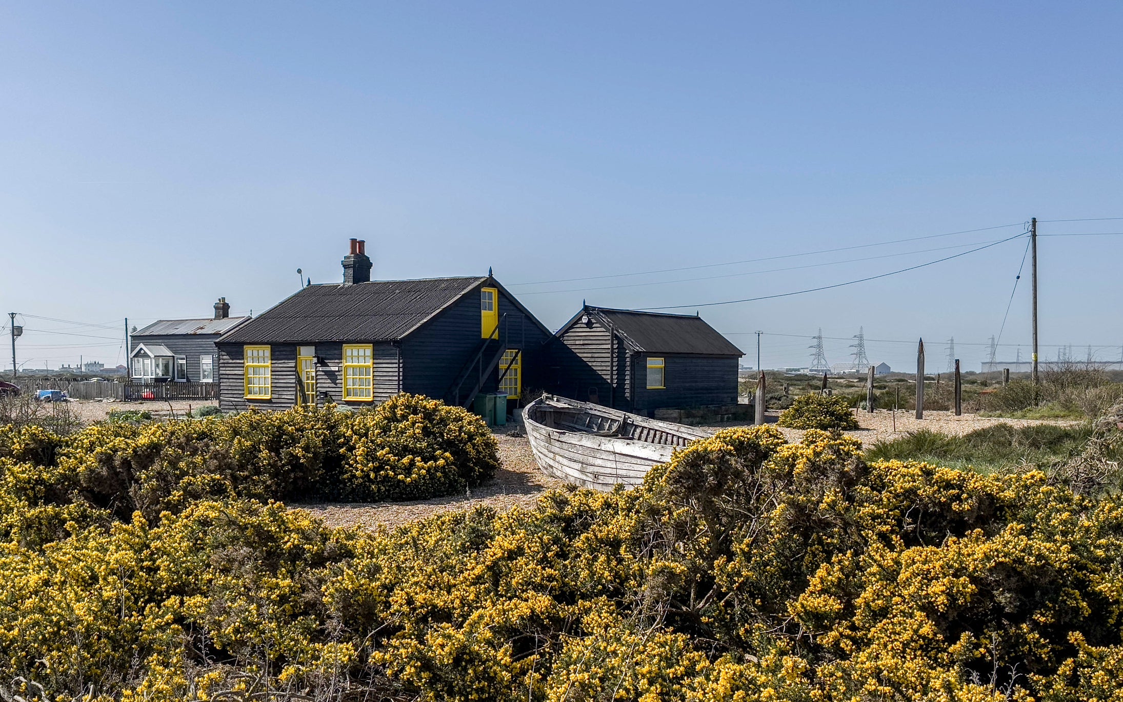The cute clapboard houses of Dungeness, East Sussex are set amongst the saltmarsh
