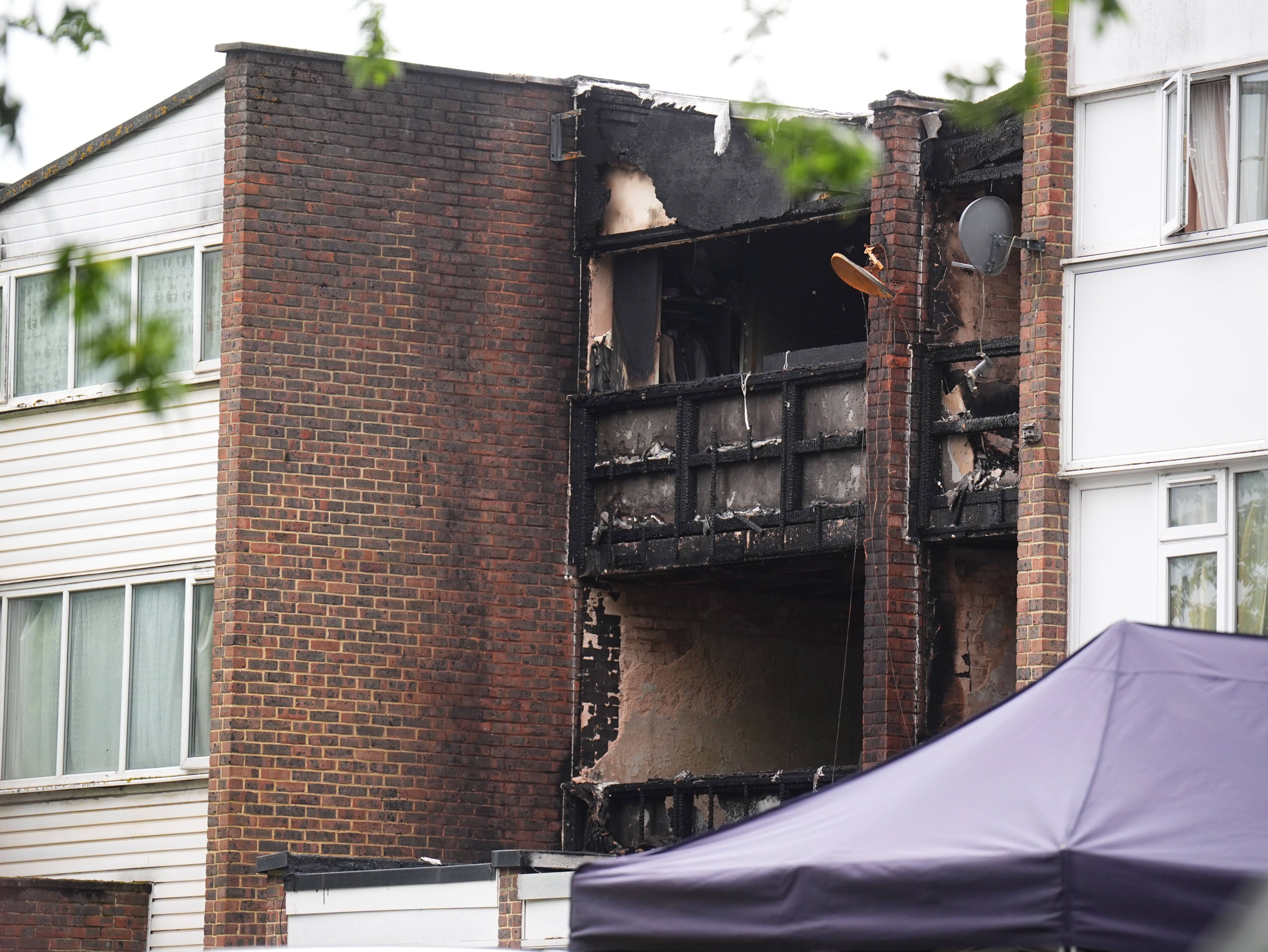 Police and fire investigators are working to establish the cause of the fatal fire, which engulfed two terraced homes