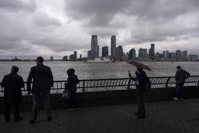 <p>People watch as ships sail by on the Hudson River during Fleet Week in New York City, U.S., May 21</p>