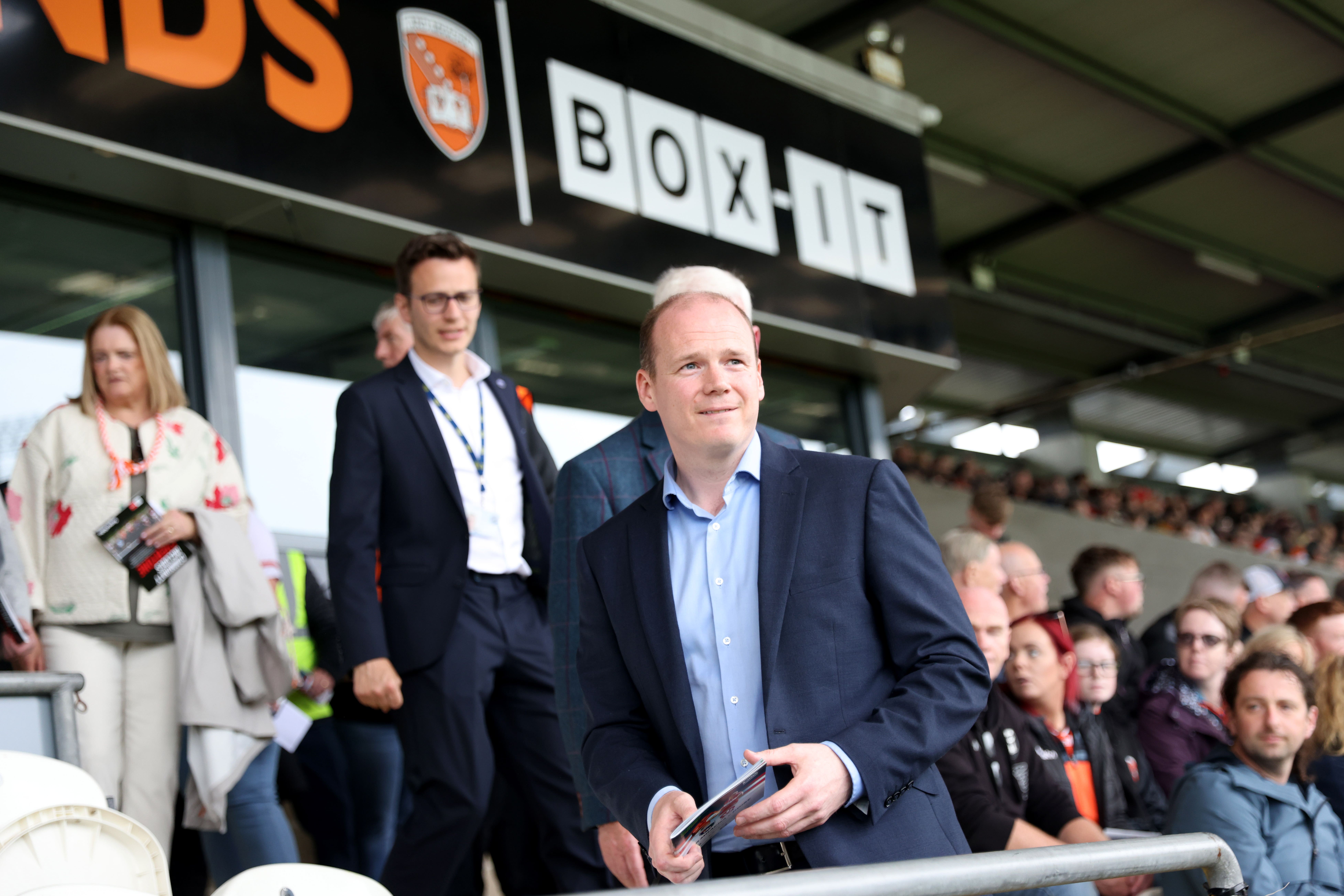 Gordon Lyons takes his seat at his first GAA match, the Armagh vs Derry Senior Football Championship (Peter Morrison/PA)