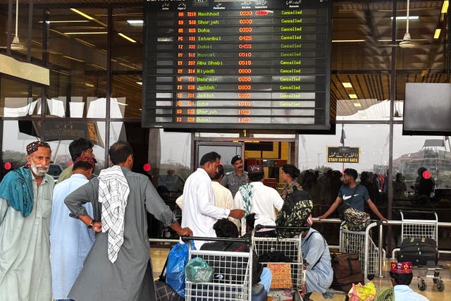 <p>Passengers wait at Jinnah International Airport </p>