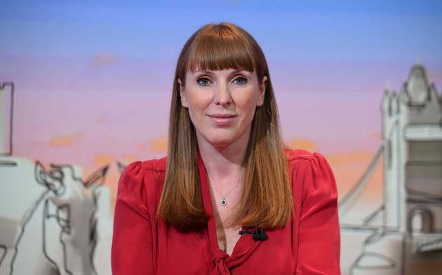 <p>Angela Rayner smiling ahead of a TV studio interview</p>