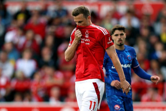 <p>Nottingham Forest's Chris Wood looks dejected against Chelsea</p>