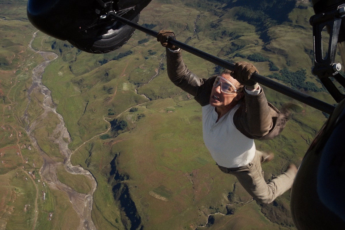 Tom Cruise director says stunt ‘separated the joints’ in actor’s fingers as he clung to biplane