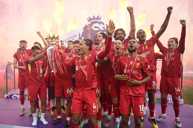<p>Mohamed Salah and Virgil van Dijk of Liverpool, lift the Premier League trophy</p>