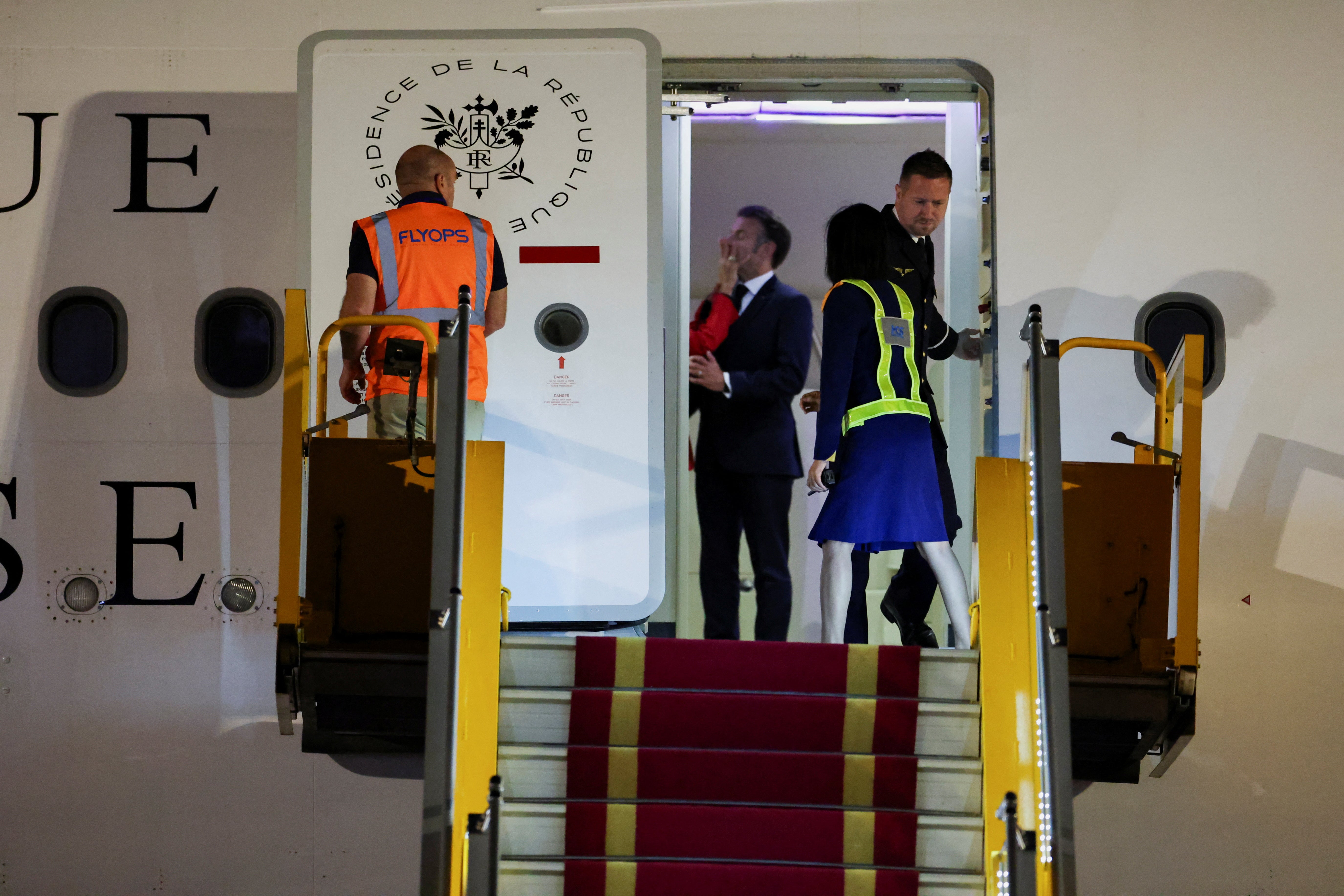 Brigitte Macron shoved her husband’s face in front of the international media as the couple arrived in Vietnam. After the altercation, Macron appeared stunned as he quickly composed himself and gave an awkward wave to the press.