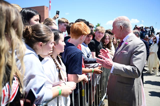 The King meets schoolchildren as he arrives in Ottawa (Victoria Jones/PA)
