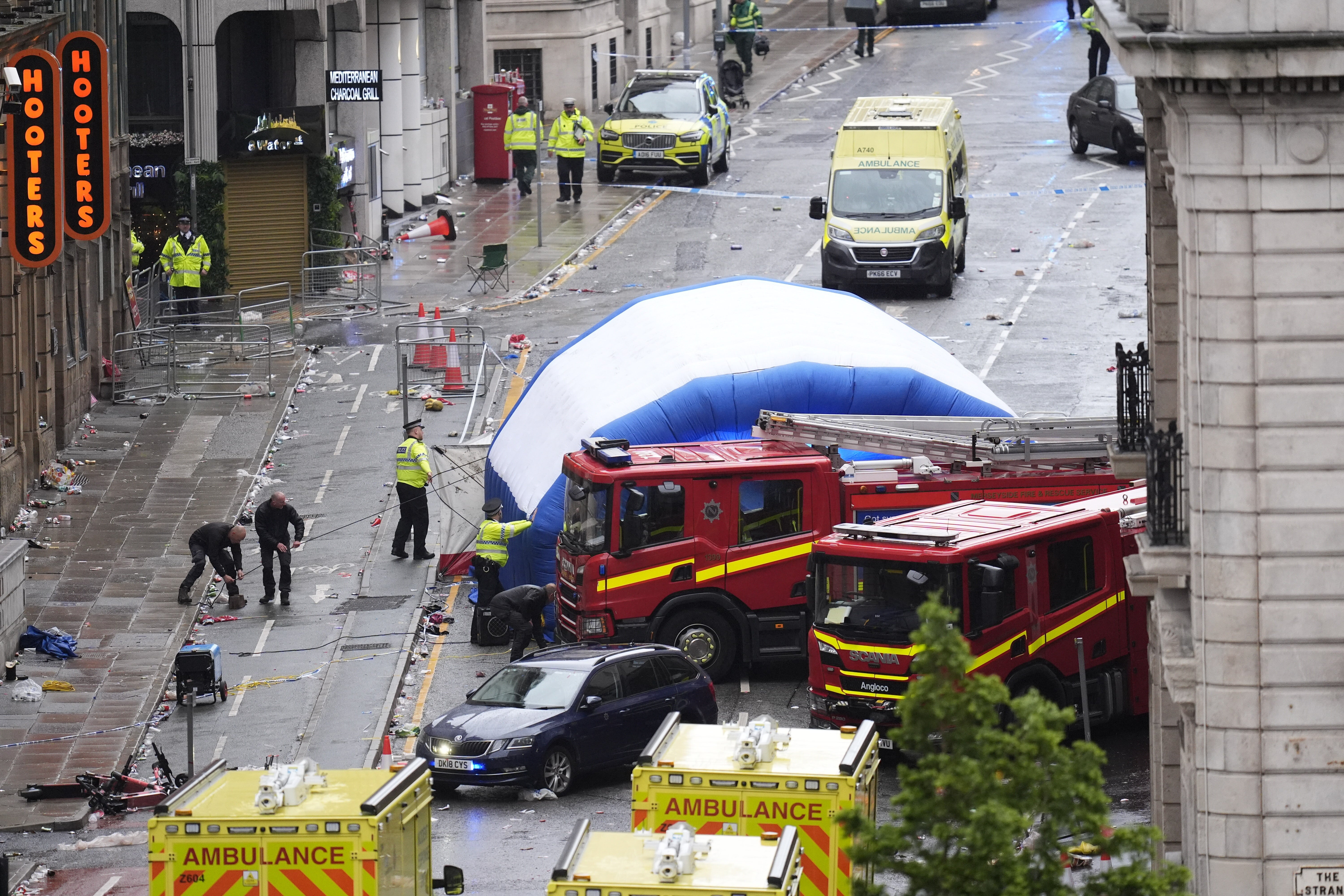 A tent is erected by police on Water Street near the Liver Building (Danny Lawson/PA)