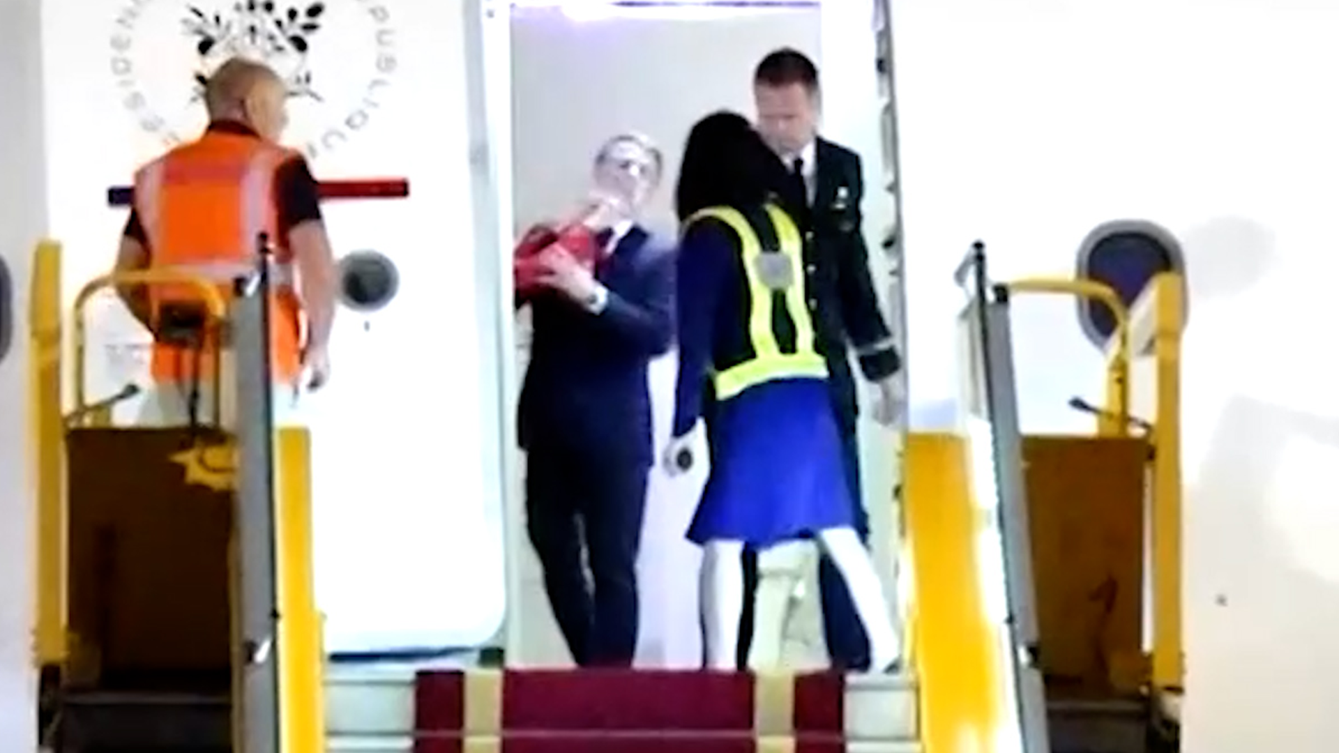 French President Emmanuel Macron's office on Monday played down an incident in which his wife, Brigitte Macron, appeared to push him in the face as the couple arrived in Vietnam at the start of a Southeast Asia tour.