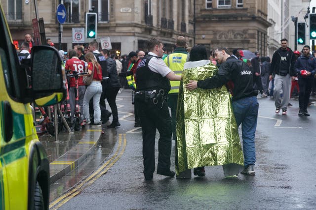 Police and emergency personnel dealing with the incident in Liverpool on Monday (Owen Humphreys/PA)