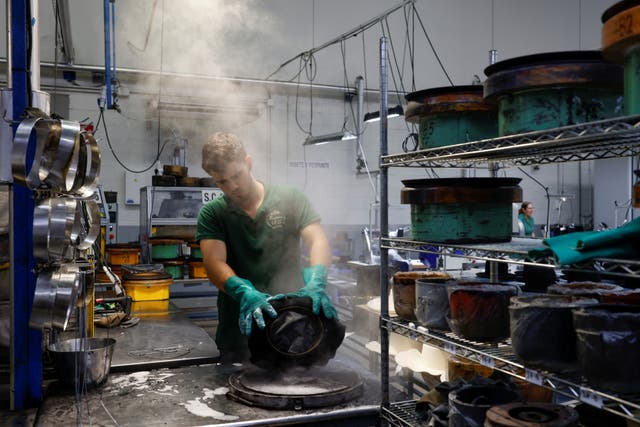 <p>A person works at 140-year-old Fernandez y Roche Industrias Sombrereras Espanolas factory, which produces Orthodox Jewish hats, in Salteras, near Seville, southern Spain.</p>