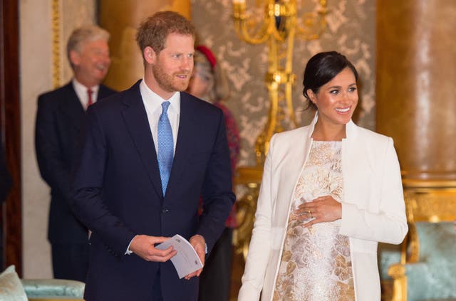 <p>Meghan, Duchess of Sussex and Prince Harry, Duke of Sussex attend a reception to mark the fiftieth anniversary of the investiture of the Prince of Wales at Buckingham Palace on March 5, 2019 in London, England. </p>