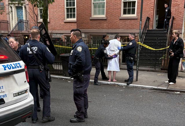 <p>New York police officers arrest John Woeltz</p>