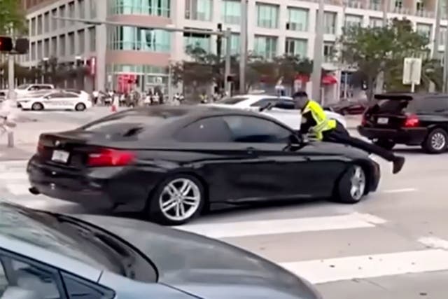 <p>Cellphone video obtained Tuesday by Local 10 News shows the chaotic moments that led to a Miami police officer opening fire while on the hood of a car near Bayfront Park</p>