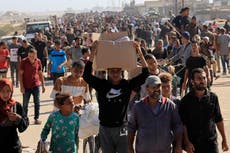 Chaos at Gaza aid site as thousands rush for food and Israeli troops fire warning shots