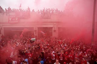 Liverpool fans line the streets during the team's victory parade in Liverpool