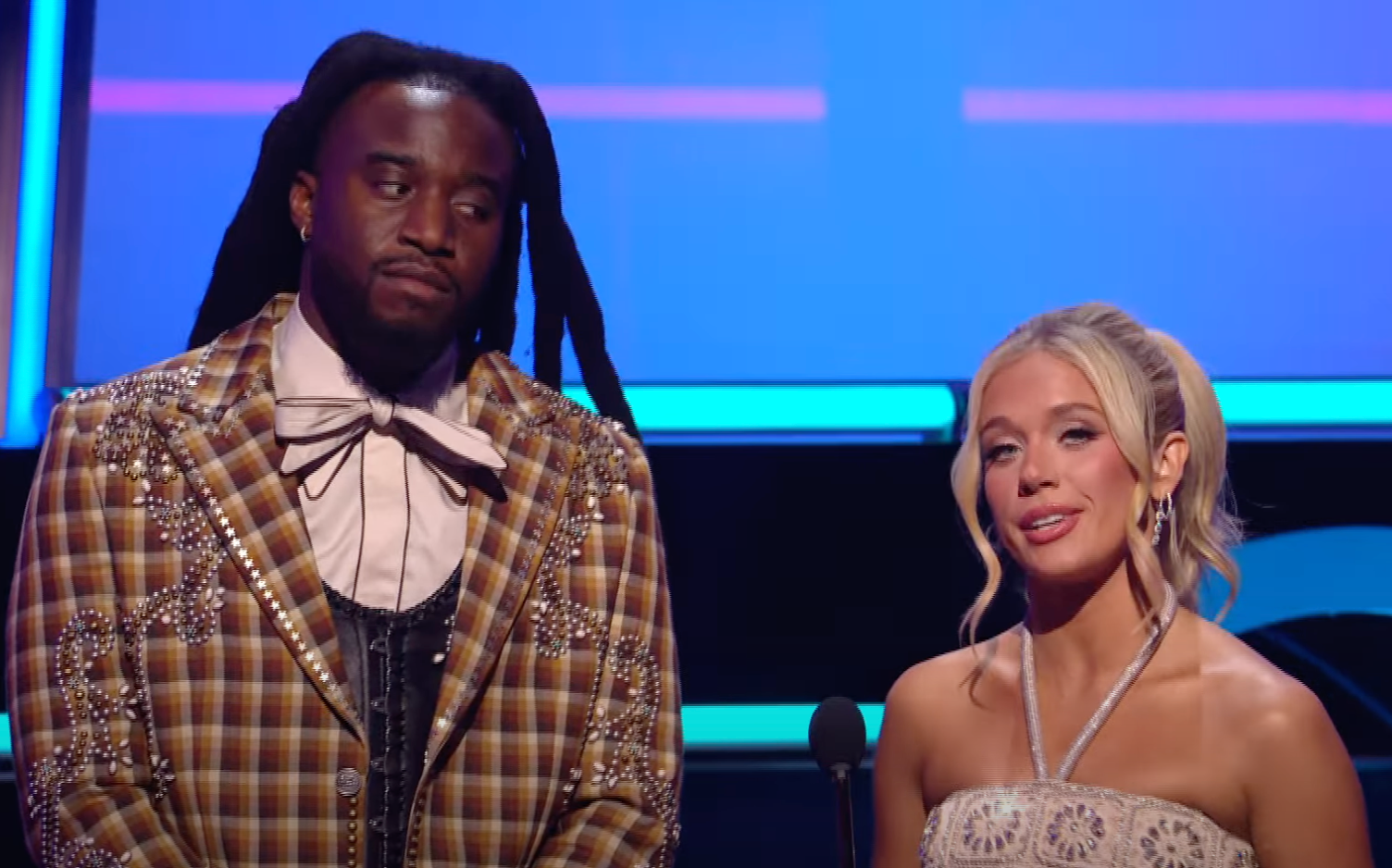 <p>Shaboozey glances at Megan Moroney after she claimed the Carter Family 'basically invented' country music</p>