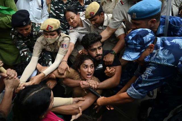 <p>Indian wrestlers Vinesh Phogat with others are detained by the police during a protest against Brij Bhushan Singh over allegations of sexual harassment and intimidation, in New Delhi on 28 May 2023</p>