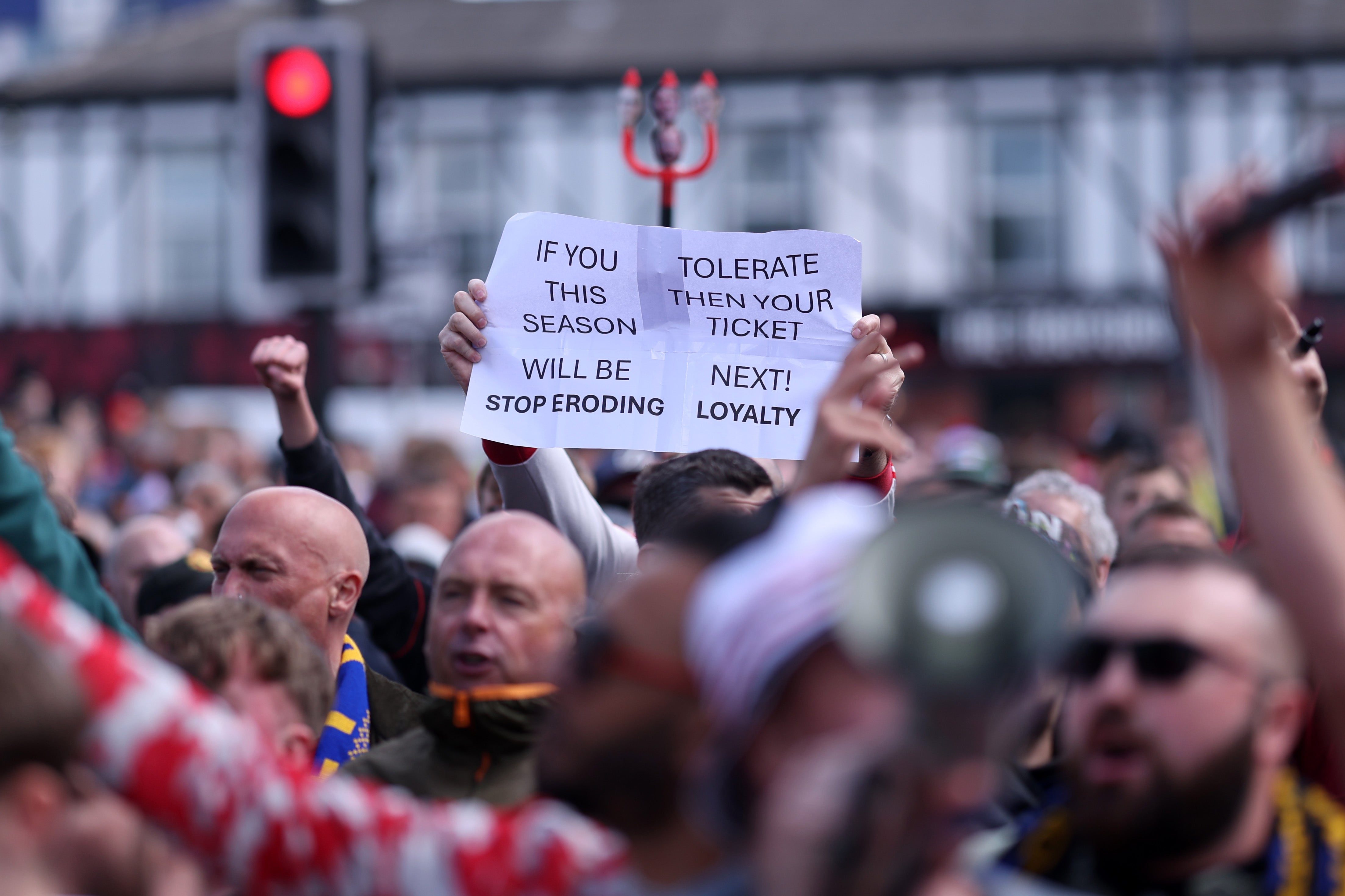Fans of Manchester United protest against the club's owners outside the stadium