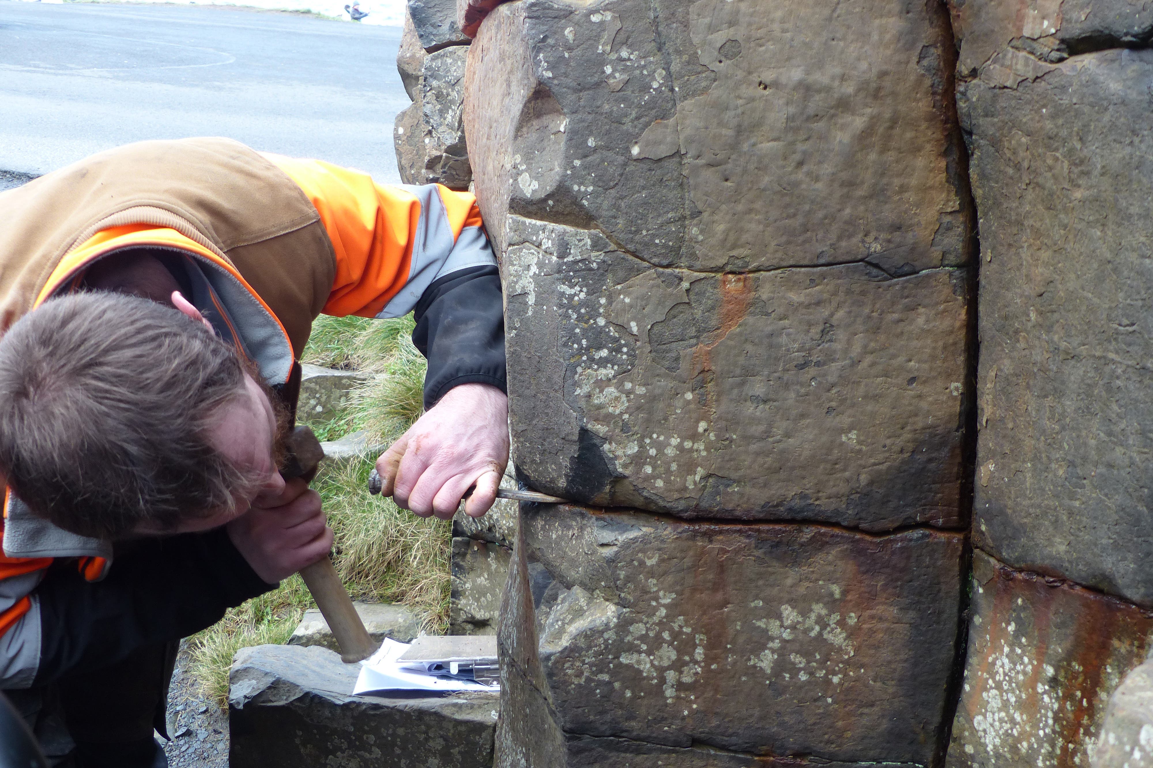 Work is taking place to remove coins which have been left at the Giants Causeway in Northern Ireland, that are causing damage to the famous basalt rock formations (National Trust/PA)