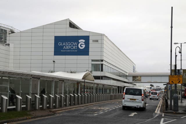The men were stopped at Glasgow Airport (Andrew Milligan/PA)