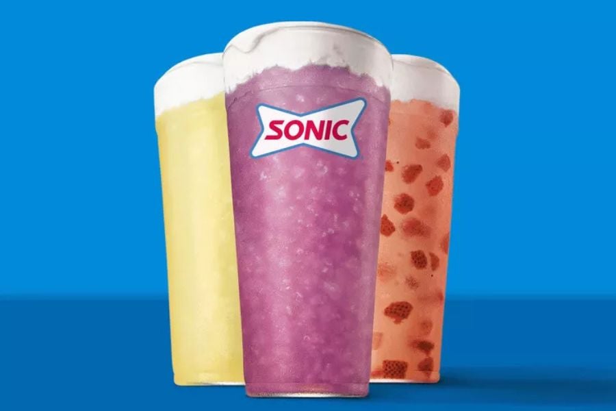  Classic, Strawberry, and Blueberry Lavender Lemonades, each topped with sweet cold foam.