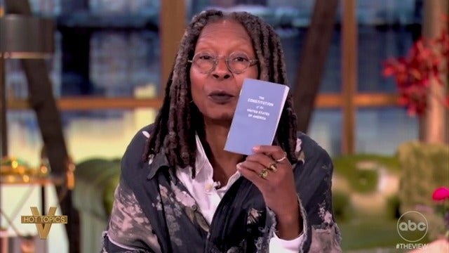 The View host Whoopi Goldberg holds up a pocket Constitution while railing against the Trump administration for pardoning supporters convicted of bank fraud.
